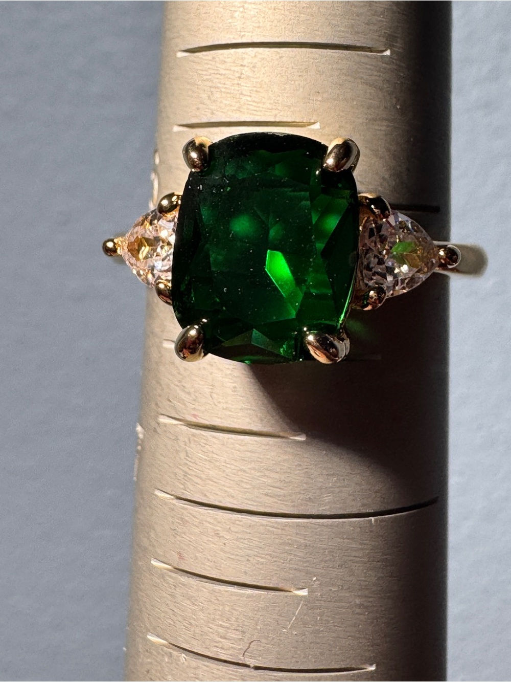 Gold Ring with Cushion Emerald Green Center Stone and Clear Side Stones